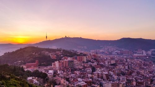 High angle view of city at sunset