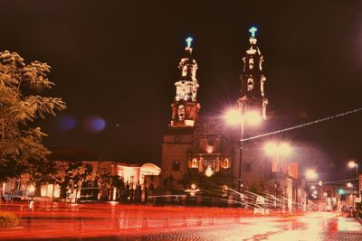 Low angle view of illuminated cathedral at night