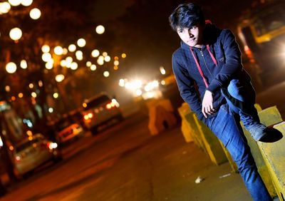 Blurred motion of man on road at night