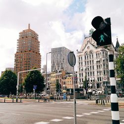 Buildings against cloudy sky