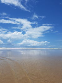 Scenic view of sea against blue sky