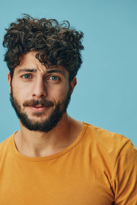 Portrait of young man against clear sky