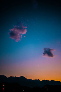 Scenic view of silhouette mountains against sky at sunset