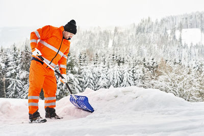 Man on snow covered land