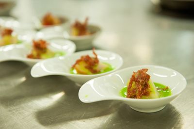 Close-up of served food in bowls on table