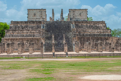 Old ruins of temple against cloudy sky