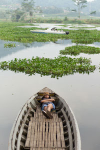 Cropped image of boat in lake