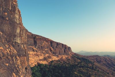 Scenic view of rocky mountains against clear sky