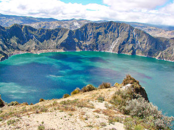 Scenic view of lake and mountains against sky