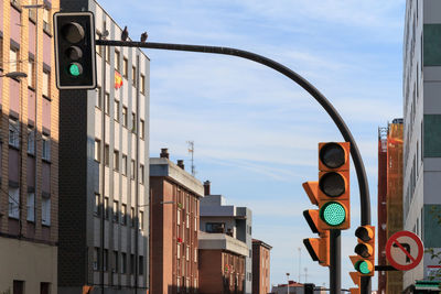 Road sign against sky