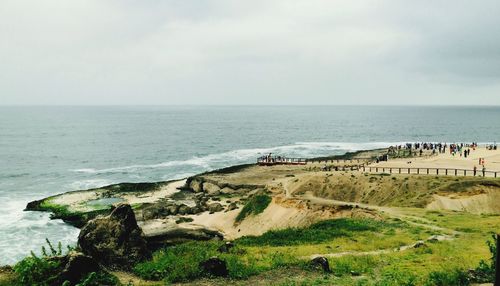 Scenic view of sea against cloudy sky