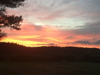 Scenic view of dramatic sky during sunset