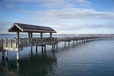 Pier over sea against sky