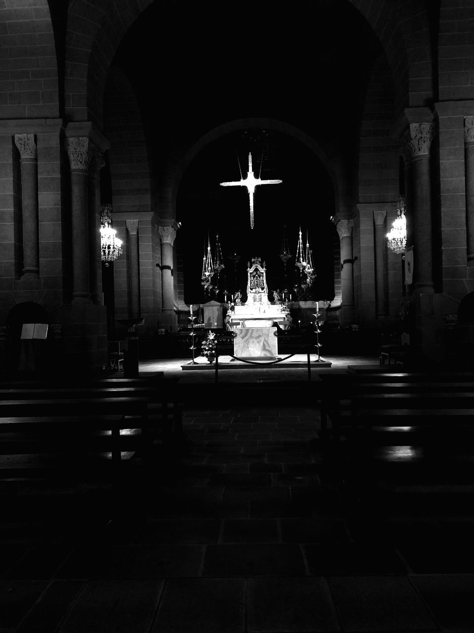 architecture, built structure, illuminated, religion, place of worship, building, spirituality, indoors, belief, candle, arch, architectural column, altar, no people, cross, pew, night, dark