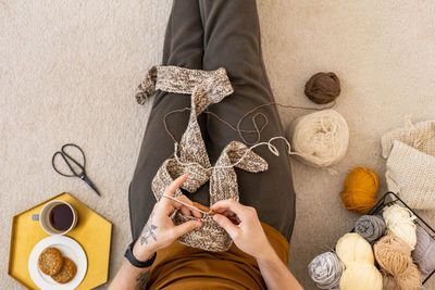 Low section of woman holding gift box