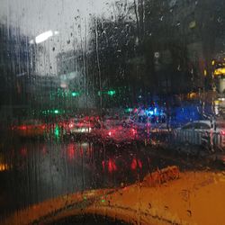 Wet city street during rainy season at night