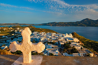 Panoramic view of cemetery by sea against sky