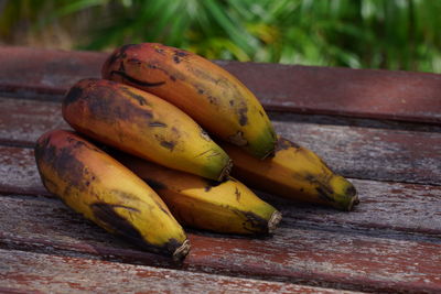 Close-up of bananas on wood