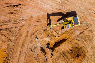 High angle view of man walking on sand at beach