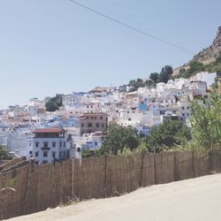 Houses against clear sky