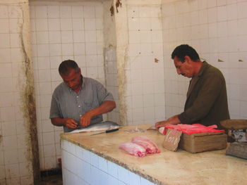 Man working on cutting board