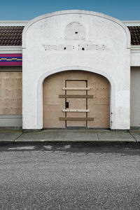 A shuttered and closed taco bell.