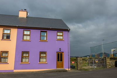 Building by street against sky