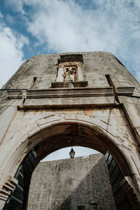 Low angle view of old building against sky