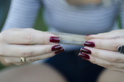 Close-up of woman holding hands
