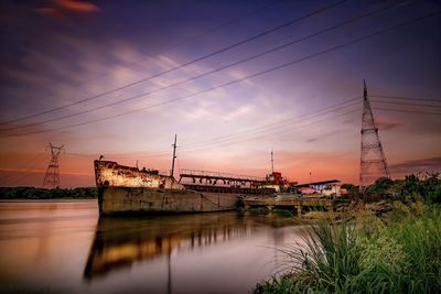 Suspension bridge against cloudy sky