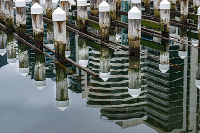High angle view of buildings by lake against sky