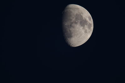 Low angle view of moon against clear sky at night