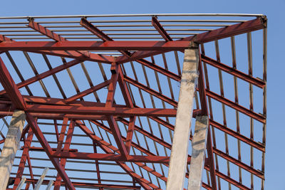 Low angle view of metallic structure against sky