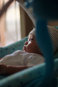 Baby boy sleeping on a rocker chair