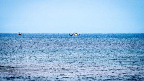 Scenic view of sea against clear sky