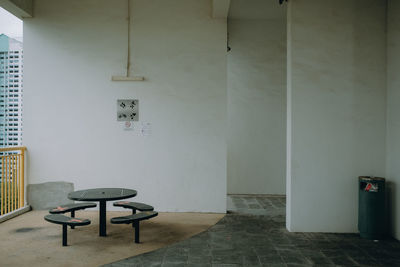 Empty chairs against wall at home