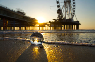 Close-up of sunglasses on beach