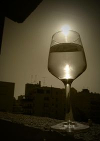 Close-up of wine glasses on table