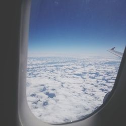 Cropped image of airplane on landscape