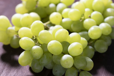 Close-up of grapes on table