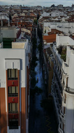 High angle view of street amidst buildings in town
