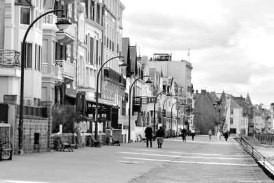 People walking on street in city