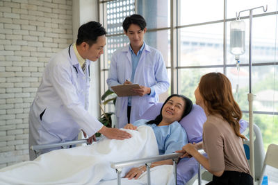 Female doctor examining patient in hospital