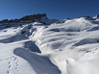 Scenic view of snow covered mountain against sky