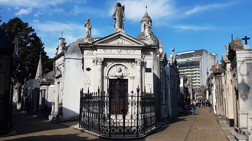 Panoramic view of buildings in city against sky