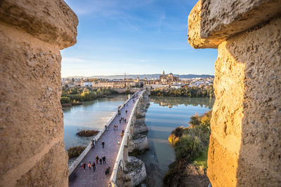 Panoramic view of bridge over river against buildings