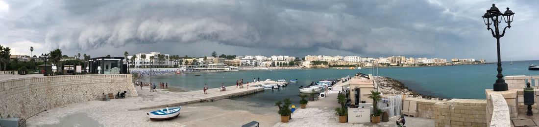 Panoramic view of beach against sky in city