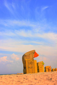 Lifeguard hut on beach against sky