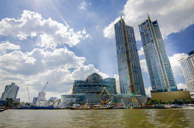 Panoramic view of city buildings against sky