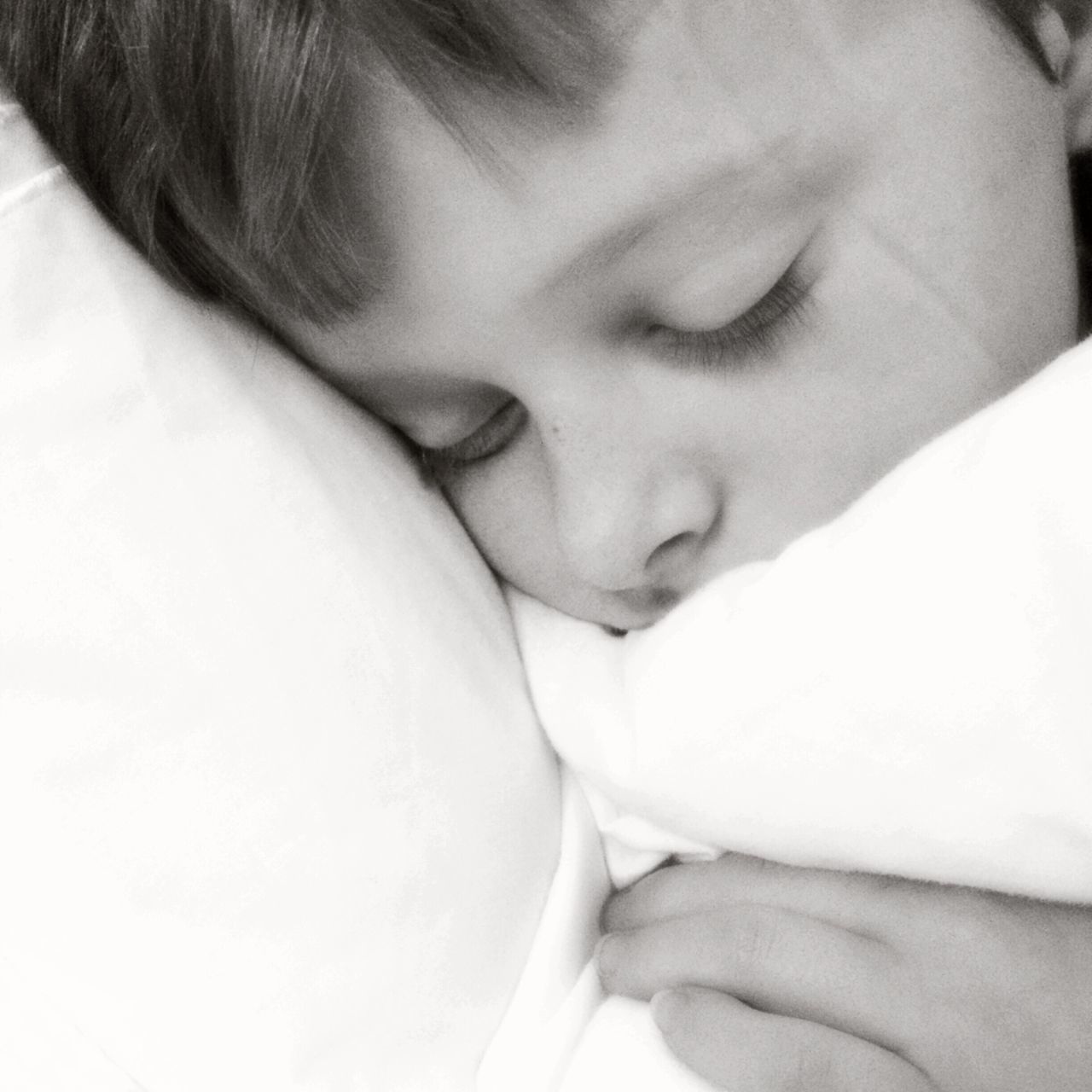 indoors, childhood, baby, close-up, lifestyles, innocence, babyhood, person, bed, leisure activity, unknown gender, toddler, headshot, cute, newborn, sleeping